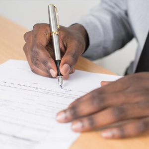 Photo of person filling out paperwork